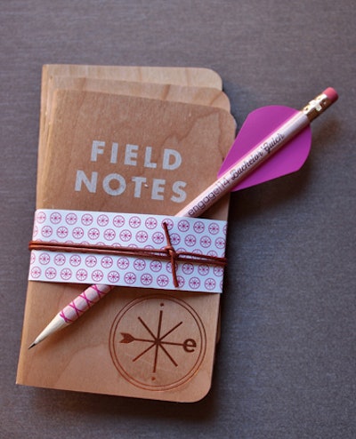 Attendees received wood-grain-inspired notebooks, complete with pencils decorated as arrows.