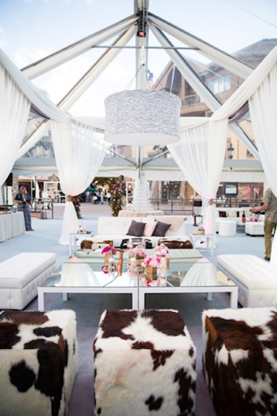 Pink Monkey Solutions created the luxe mountain look for the opening night party, using cowhide-covered seating inside the Event Rents tent.