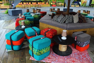 The Fast Company tent, with dramatic lighting and colorful seating, was a focal point to the plaza, which was designed with a more festive, casual feel than the indoor conference.