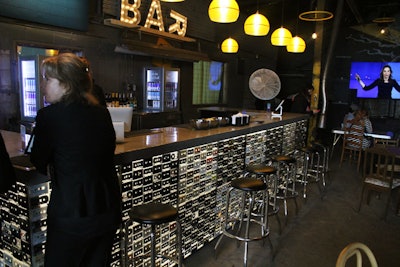 The bars at the conference each had a different design. In the Garage space, retro cassette tapes covered the bar front.