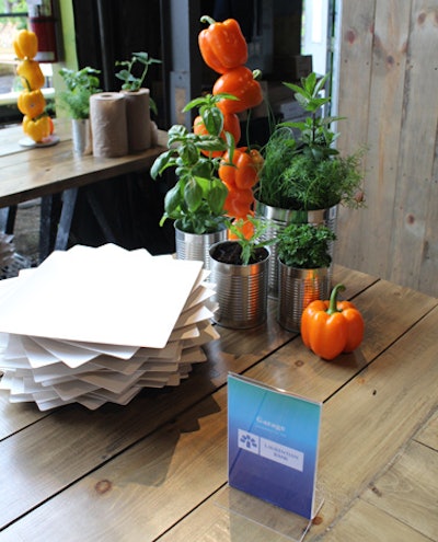 In the food area, colorful vegetables and herbs in tin cans provided a rustic contrast to the high-tech spaces inside.