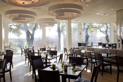 The highly anticipated Chavez opened in February in the Radisson Hotel & Suites Austin Downtown. Helmed by chef Shawn Cirkiel, the restaurant offers three private dining options: the 40-seat Lady Bird Lake Room, with floor-to-ceiling windows overlooking the lake; the 24-seat Cava Room; and the Pool Deck, a covered terrace with an infinity-edge pool. Cocktail menus and a full bar are available.