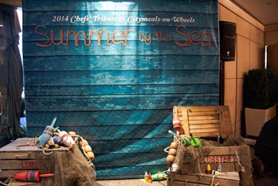 The photo backdrop was flanked by restored lobster crates, fishing nets, and buoys.