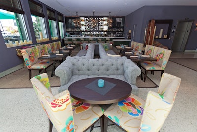 For open-air events, the Surfcomber hotel redesigned its lounge, the Social Club. The Kimpton property's lounge features indoor and outdoor seating in a modern tropical color scheme. Its menu features Latin-infused bites such as Bahamian conch tacos and green vegetable gazpacho and libations such as a Pisco punch. The Social Club seats 45 or holds 100 for receptions.