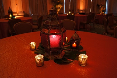 Lanterns, whether simple or ornate, offer a theatrical alternative to traditional tabletop decor. Style the lighting items to suit any event theme or atmosphere, such as the Moroccan-inspired ones used by Showorks.