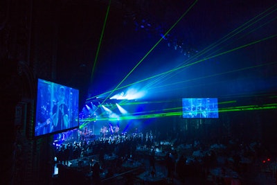 After a brief speaking program and a video, the stage transformed. A laser show began, and a 24-foot video wall dropped down from the ceiling. A stage for the surprise headline performer was revealed, and it rolled forward on top of the Wang Theater's existing stage.