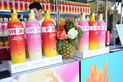 Organizers bypassed vases in favor of pineapples, which housed vibrant floral arrangements.