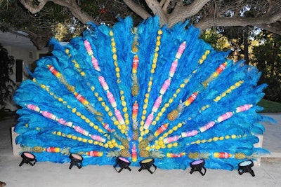 Pineapples, lemons, and Svedka vodka bottles dotted a step-and-repeat fashioned to resemble the feathered headdresses worn by Rio Carnival dancers.