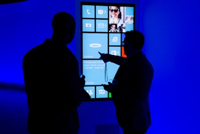 Inside, the first step for guests after receiving their credentials at check-in was a tour of Cortana's capabilities. The space was surrounded by curved walls, leading attendees in a circle around the perimeter of the venue.