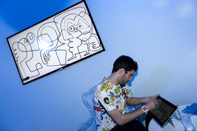 In another area an artist created live portraits of guests using the Fresh Paint app on a Microsoft Surface tablet. Images were displayed on a larger screen behind him.