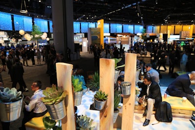 Live greenery decorated the networking area, from large, potted trees to smaller plants in tin cans. Electrical outlets and charging stations were also located throughout the space.