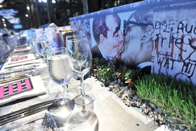 A miniature replica of the Berlin Wall, complete with graffiti, decked the long dinner table for the Big Bang Bash.