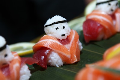 Sushi rice “soldiers” made with fresh salmon and tuna sashimi and garnished with edamame, by DNA Events Inc. in Los Angeles