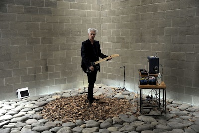 Within the confines of the uneven stone path that bridges the entrance of the center to the main party space was Jim Jarmusch and Phil Kline's 'Music for Nikola Tesla.' The performance featured music to be featured in an upcoming collaboration between Jarmusch, Kline, and Bob Wilson.