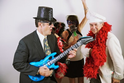 Guests enjoying a FlipBook station at a corporate event