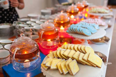 Occasions Caterers served hot tea with pink, yellow, green, and blue iced cookies for dessert in the publisher's reception.
