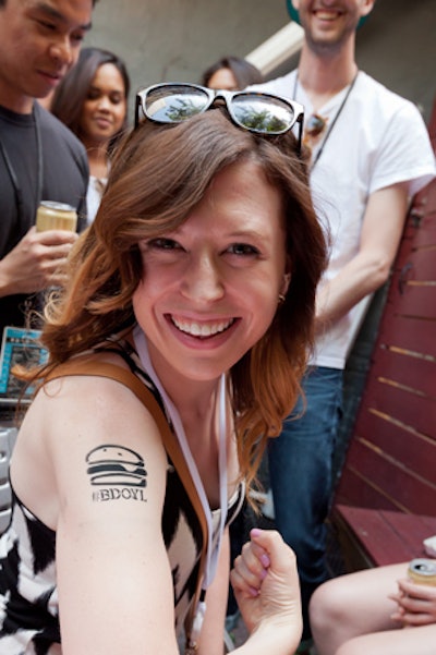 Guests could get branded airbrushed tattoos, choosing from three images: a cheeseburger, a bottle of beer, or the Thrillist logo.