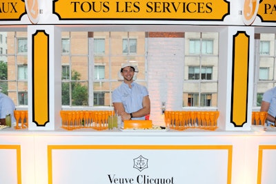 Directly opposite from the food station was a similar setup where guests could have their champagne flutes topped off. Postal stations on either side allowed guests to fill out postcards given at check-in and have a bottle of Veuve Clicquot sent to themselves or a friend in celebration of summer.