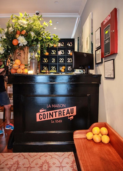 Once inside, guests met a traditional reception desk that was rebranded for the evening with Cointreau signage and orange accents. In keeping with the hotel atmosphere, guests were also given hand-tooled leather key chains that mimicked hotel room keys upon arrival as keepsakes.