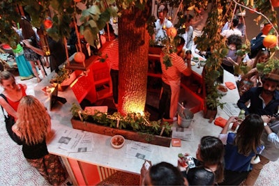 A faux marble bar top was set up around the base of the orange tree where Cointreau-infused cocktails were served. Dispersed throughout the venue was a specially printed broadsheet version of the Cointreau brand guide book that guests could take as a collectible.