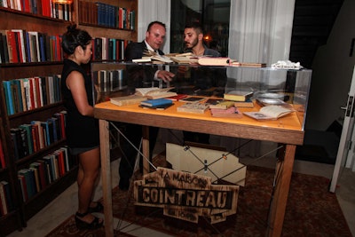 In the library, guests, who donned white gloves, could peruse through a selection of Cointreau's antique and historic cocktail books (many of which feature the Cointreau name as a specific ingredient) while a brand expert provided detailed information and factoids on the history of Cointreau.
