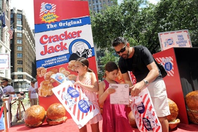 The Cracker Jack brand hosted an event last month in New York's Herald Square to kick off its 'Surprise Inside Project.” The event featured two larger-than-life Cracker Jack boxes, one standing 15 feet tall and a second filled with oversize popcorn kernels and small surprises for kids to discover.