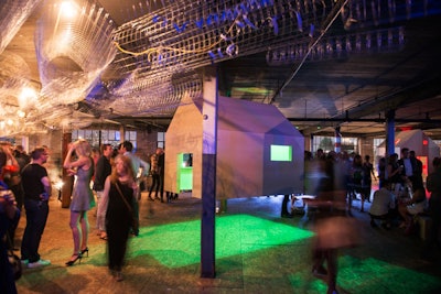 Miniature plywood houses were suspended from the ceiling, and guests could explore the interiors.