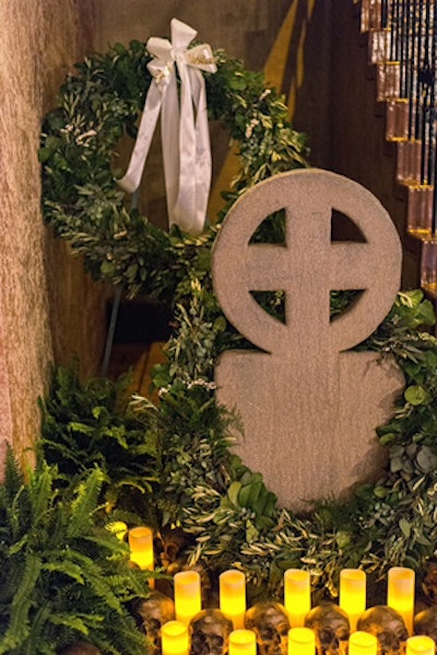 Tombstones, skulls, and funeral wreaths made for macabre decor and fit in perfectly with the event's funeral theme.