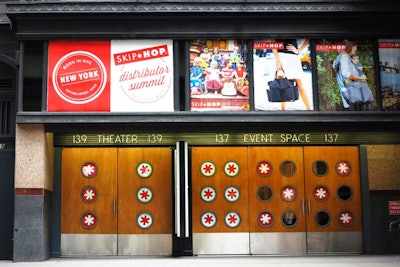 Street-level signage on event space and theater entrance.