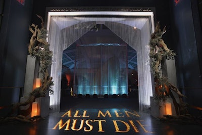 Metal chain curtains provided a dramatic reveal as guests entered the event