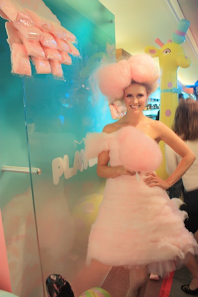 A 'cotton candy girl”—dressed in an outfit made from the confection—passed out the dessert to guests of M.A.C. Cosmetics' Los Angeles celebration of its Playland collection on April 10.