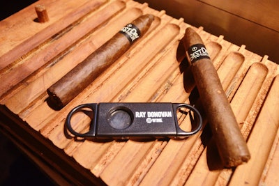 Cigars and cigar cutters also displayed the logos for Ray Donovan and the event. Other branded items promoting the boxing drama included pint glasses and autograph cards for former heavyweight champ Riddick Bowe to sign.