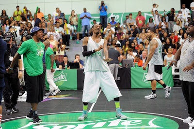 Celebrity basketball game participants, including Snoop Dogg, sported jerseys emblazoned with the BET Experience and Sprite logos.