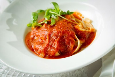 Tagliatelle with roasted tomato sauce and basil garnish