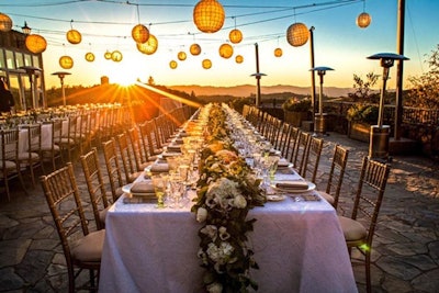 Hanging Pacific Collection Lanterns above guests at sunset wedding reception in Napa Valley, California