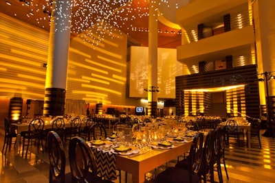 Video mapping and golden amber lighting at SFMOMA Director's Circle Dinner