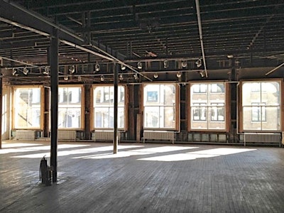 Floor to ceiling windows, natural daylight, hard wood floors