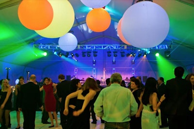 Inflate Collection - Multi-colored hanging inflatable spheres above dance floor at tented wedding reception