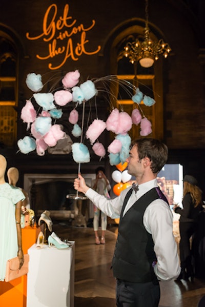 In late February, fashion retailer Ted Baker hosted a private event in New York to preview its Spring/Summer 2014 line. Inspired by the circus theme of the collection's ad campaign, caterer Creative Edge Parties served carnival finger foods in a playful, mess-free way. That included staffers circulating with what they called a cotton candy tree—cotton candy clipped to a willow-tree-shaped metal frame that guests could easily pull off with their hands.