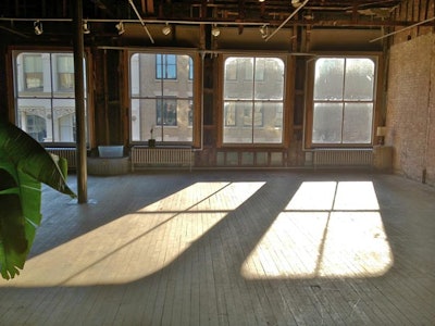 Natural light dark hard wood floors with eastern and western daylight
