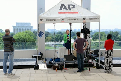 Live broadcast standups on the USIP Solomon Roof Terrace