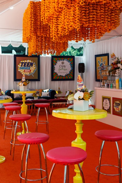 Hightop tables and stools in bright pops of color helped add a playful vibe to the tent.