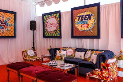 An eclectic mix of bright furniture and framed logos evoked a sophisticated yet playful art studio feel at Fox's V.I.P. tent.