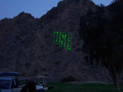 Laser logo on mtn. at the US Gypsum national convention in Palm Springs at dusk
