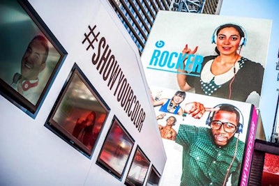 The booth shows their photos before it hits the big screen in Times Square
