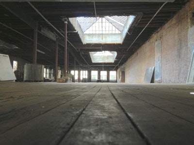 Two 20 x12 skylights with natural daylight exposed brick walls dark hard wood floors
