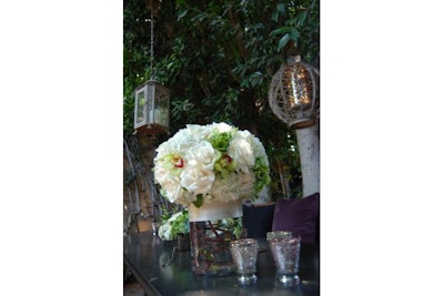 A beautiful bouquet of fresh flowers accent each table.
