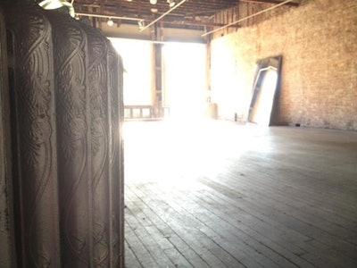 200 feet exposed brick walls, dark hard wood floors, and cast iron round radiators