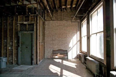 Exposed brick walls, dark hard wood floors, flood of natural daylight
