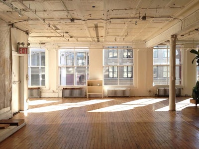 Natural daylight loft with light hard wood floors and original time ceiling